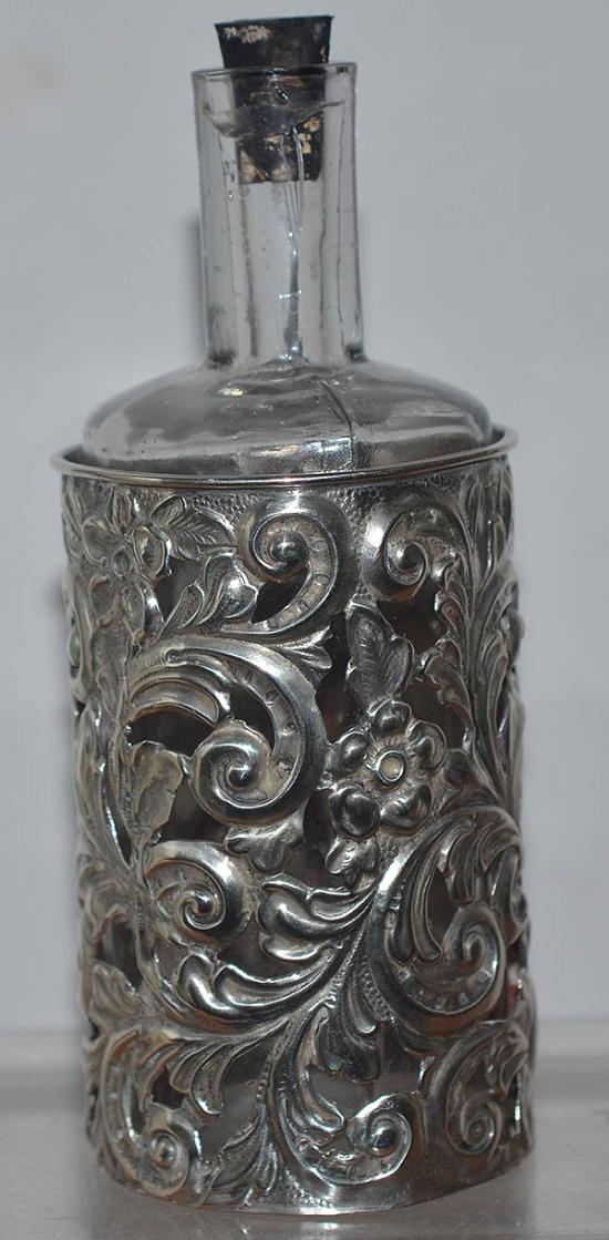LATE VICTORIAN PERFUME BOTTLE WITH ORIGINAL SILVER HOLDER.