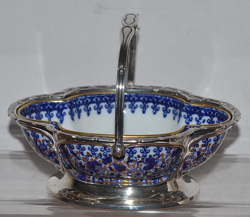 EDWARDIN SILVER BASKET WITH DECORATIVE CHINA INSERT BOWL.