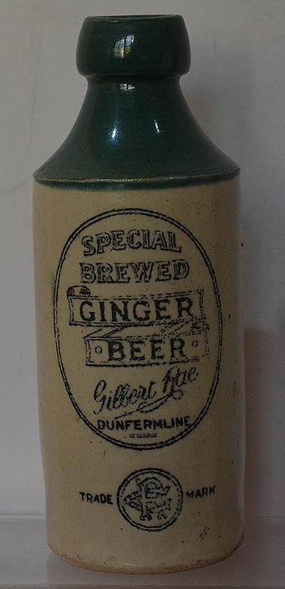 GINGER BEER BOTTLE WITH GREEN TOP.